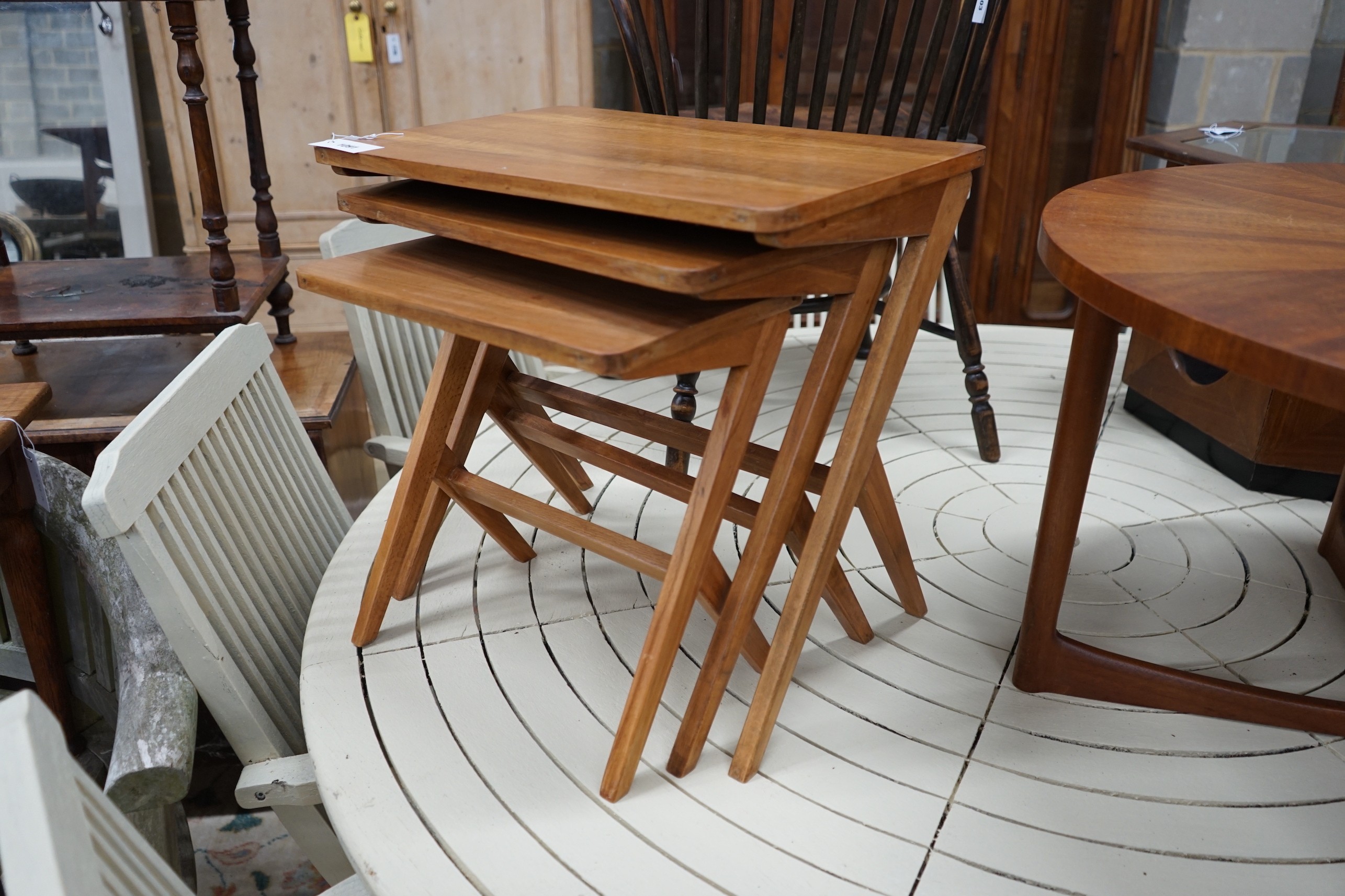 A mid century design nest of three rectangular tea tables, width 54cm, depth 35cm, height 50cm